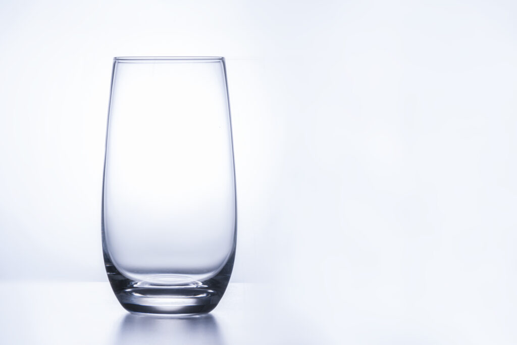 empty glass glass on a white background. copy space